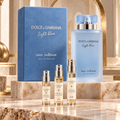 Dolce & Gabbana Light Blue Eau Intense for women with Alabaster Elixir 2 ml, 5 ml and 10 ml decant atomizers on a marble display.